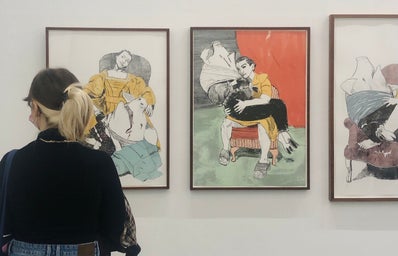 woman viewing images at art gallery