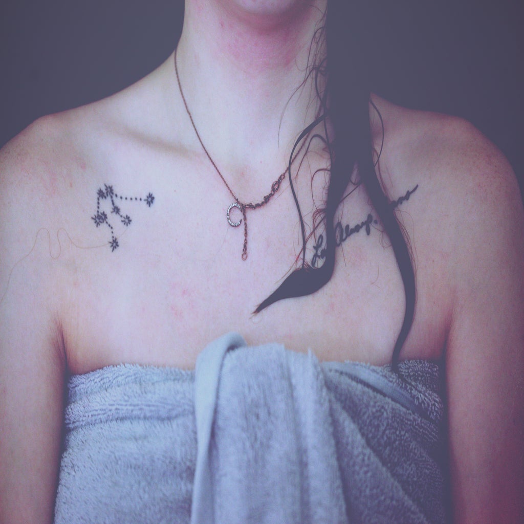 Collar Tattoos on Woman wrapped in towel