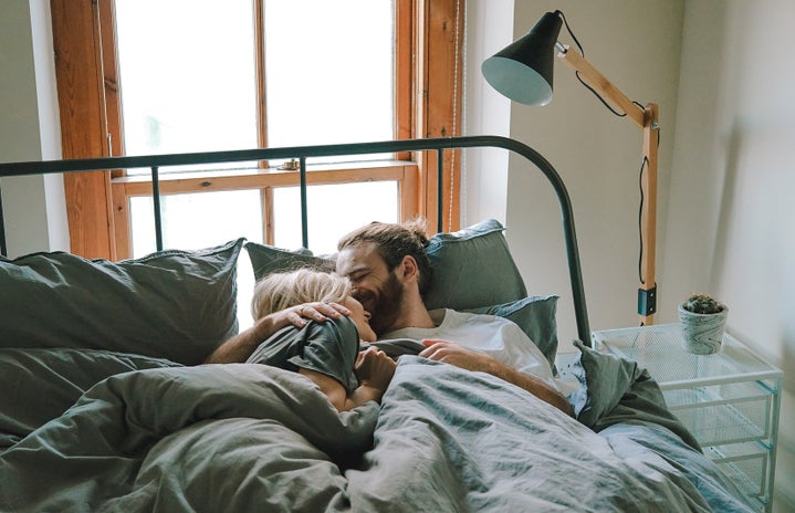 Couple kissing in bed by Unsplash?width=719&height=464&fit=crop&auto=webp