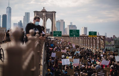 crowd of protesters on a bridge