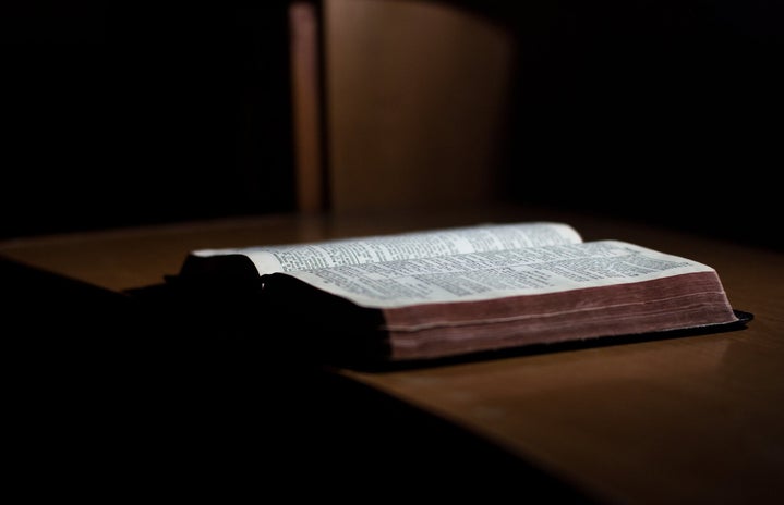 open book on a table in the dark