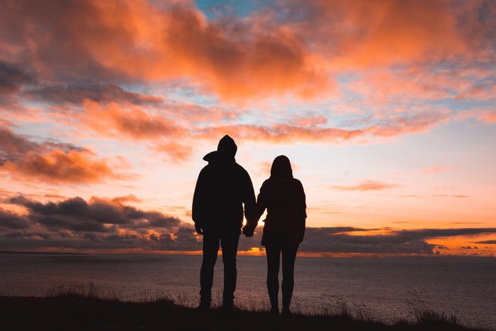Couple holding hands at Sunset by Unsplash?width=698&height=466&fit=crop&auto=webp