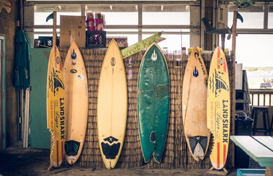 six assorted-color surfboards