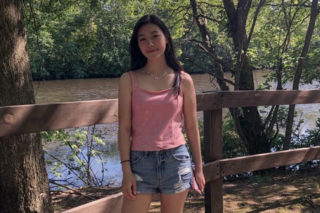 woman in front of a river