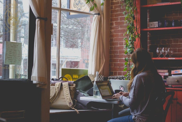 woman typing on laptop in cafe by Bonnie Kittle from Unsplash?width=698&height=466&fit=crop&auto=webp