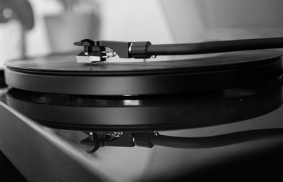 \"grayscale photo of vinyl player\"