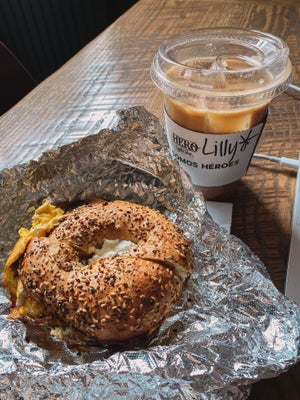 Bagel sandwich and coffee on a table