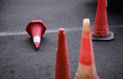 3 cones one knocked over