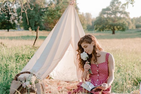 Girl reading at a picnic