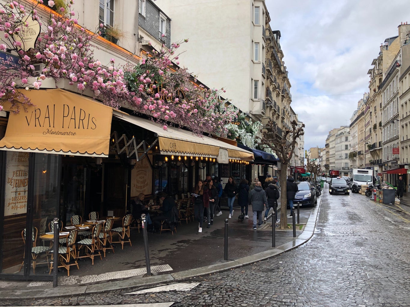 Paris streetview Montmartre cafe with pink flowers