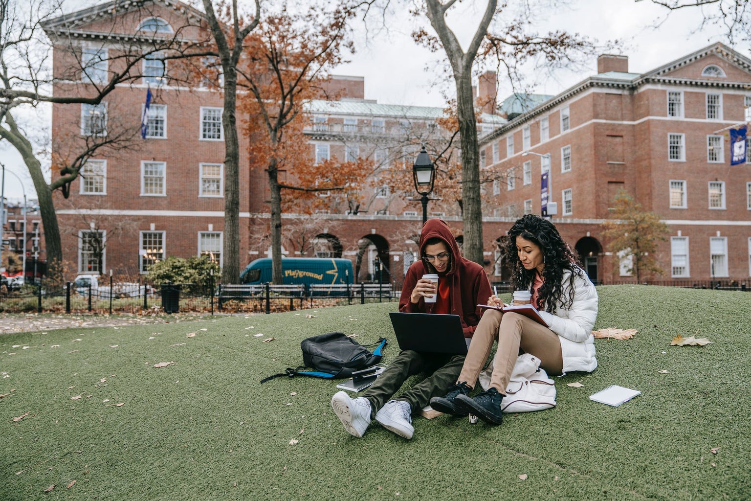 white long sleeve shirt sitting on grass