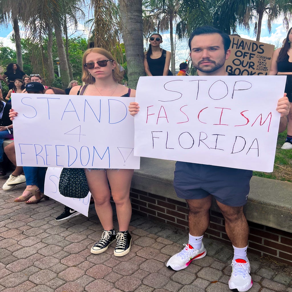 protesters holding signs