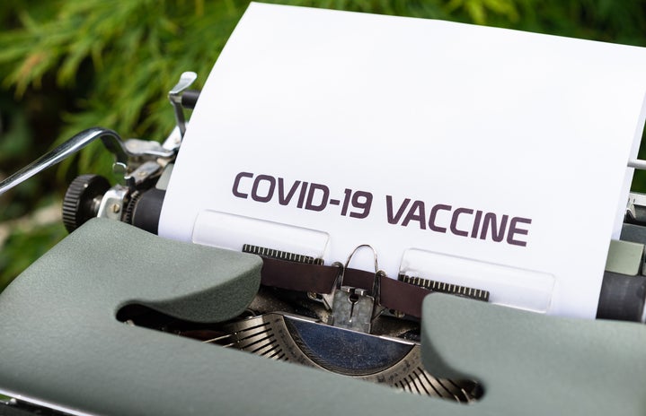 \"COVID-19 VACCINE\" typed on paper in a typewriter