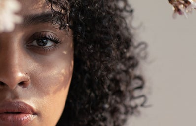 black woman with about half of her face showing