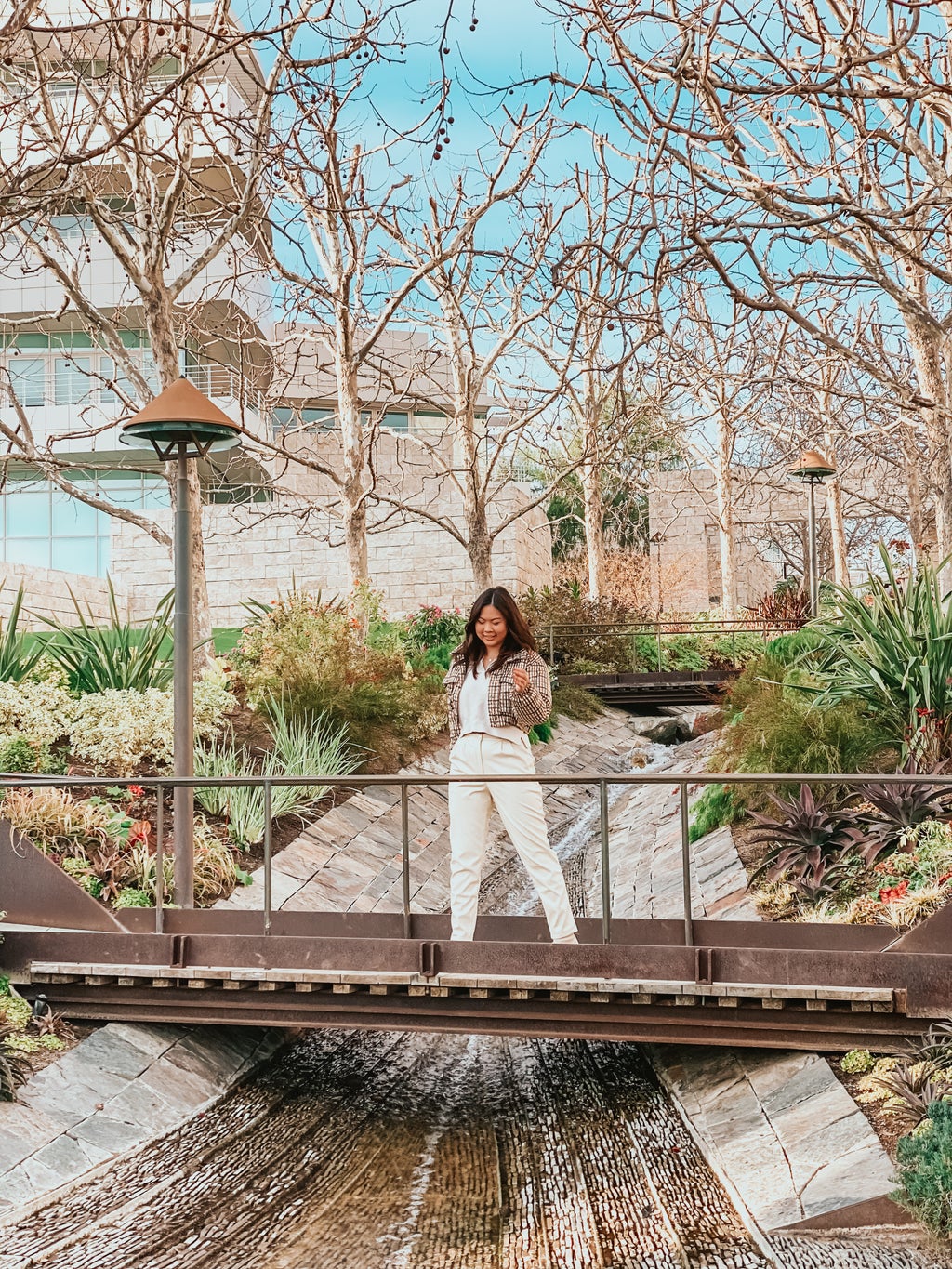 woman in Abercrombie sweater and leather pants