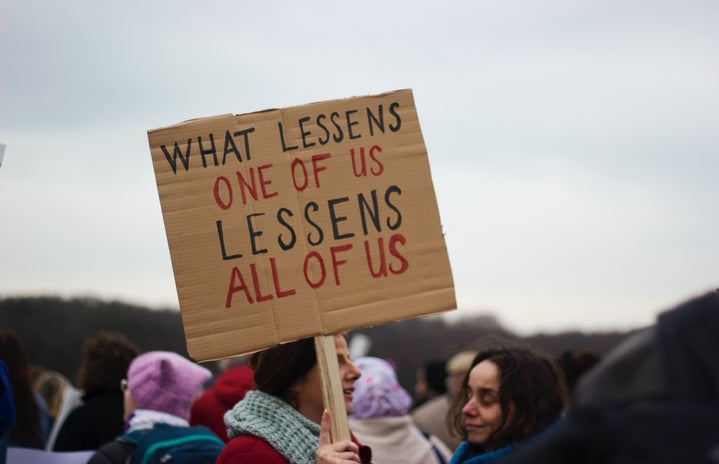 protest sign by unsplash?width=719&height=464&fit=crop&auto=webp