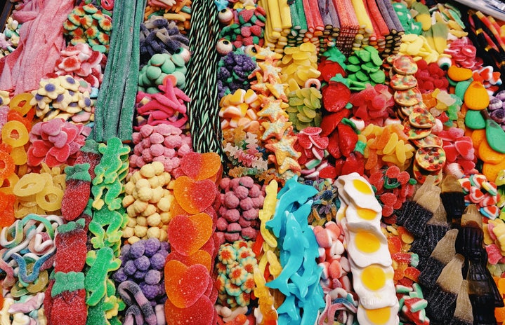 Different types of candy are spread out on a table.