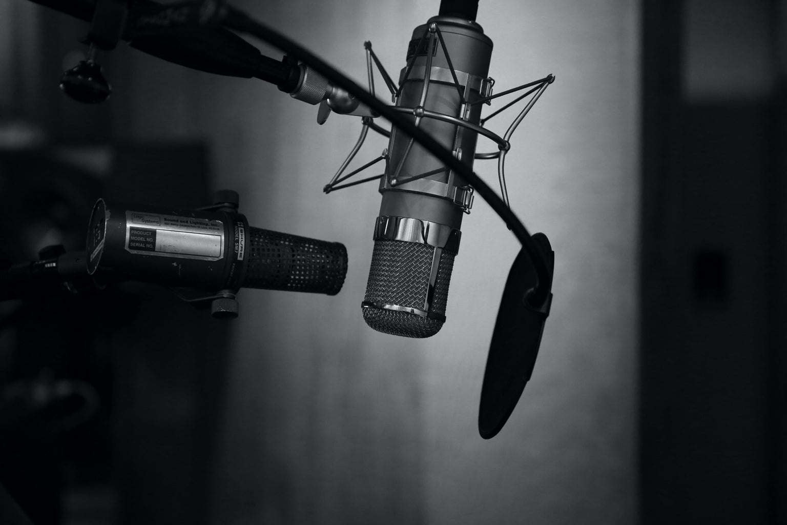 grayscale photo of a podcast setup