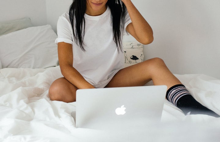 Woman sitting on bed with laptop by Charles Deluvio on Unsplash?width=719&height=464&fit=crop&auto=webp
