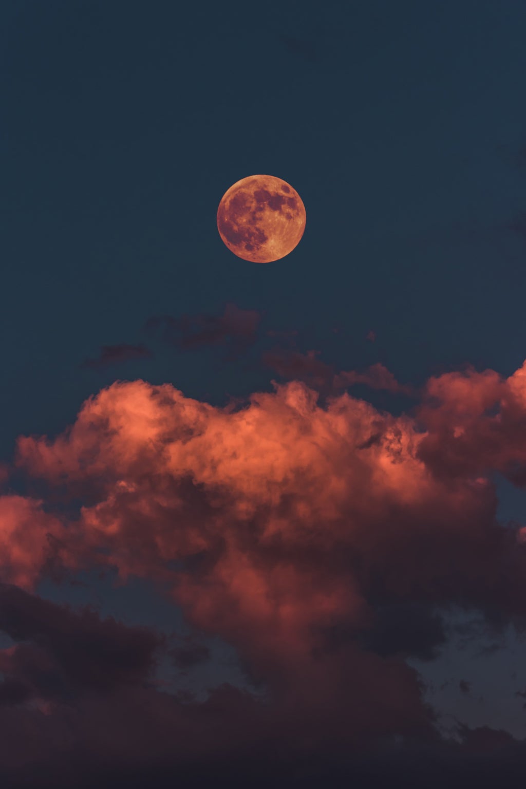 orange full moon and clouds