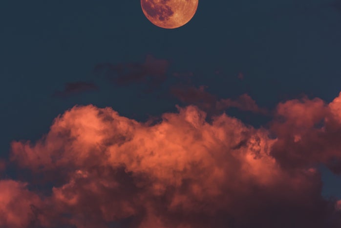 orange full moon and clouds