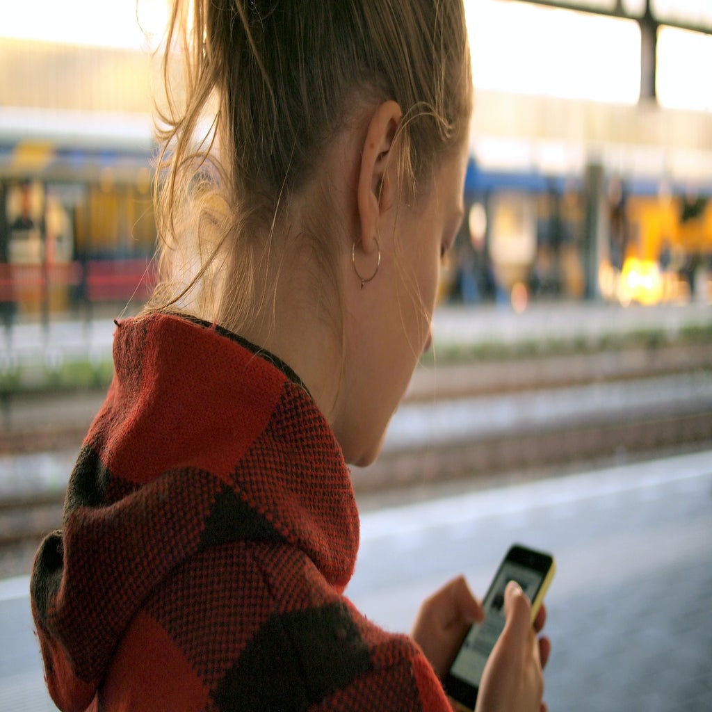 Girl by train tracks