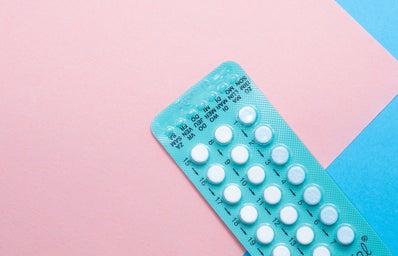Blue birth control packet with pink background