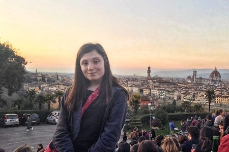 woman standing in a crowd in Florence, Italy