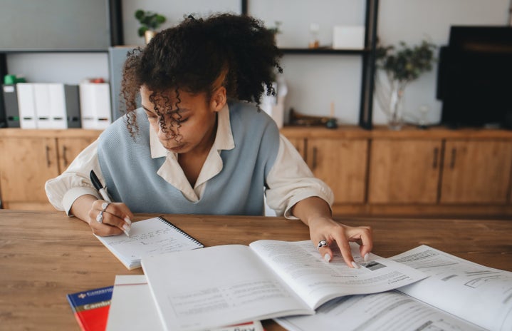 woman student doing homework