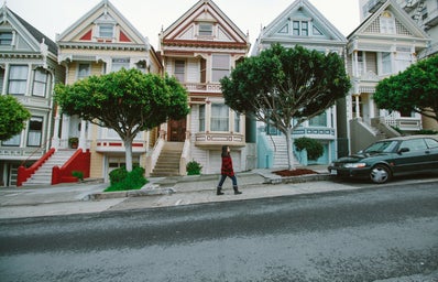 San Francisco houses, lady walking in front of them