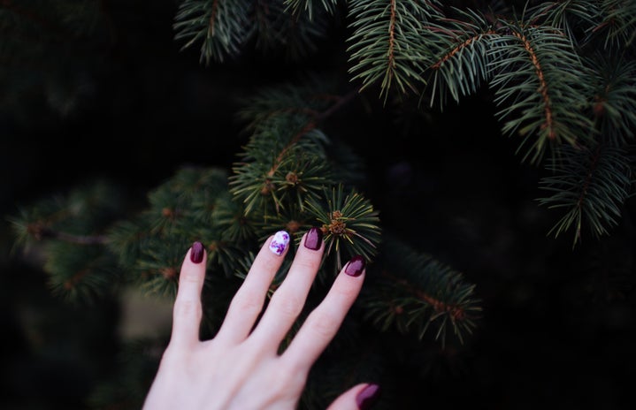 red nails on a dark green background