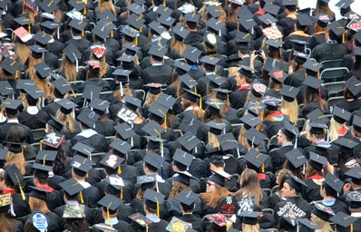 crowd of graduation students wearing caps