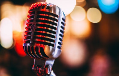 vintage microphone with colorful lights in the background