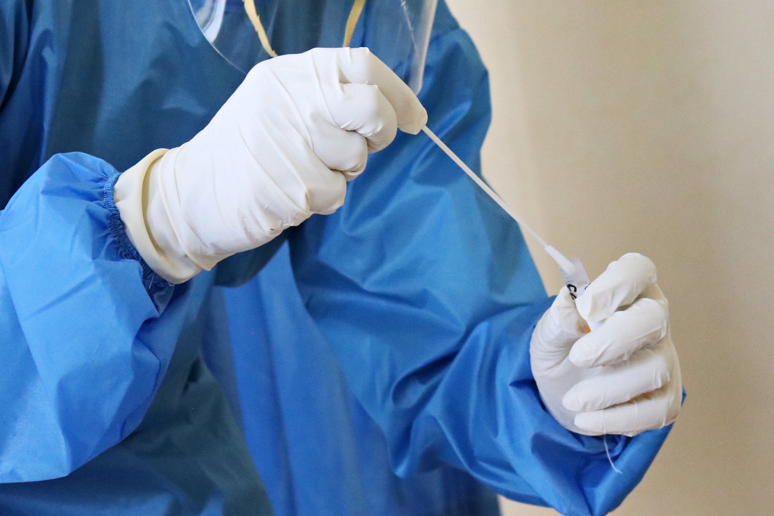 medical worker takes a swab test