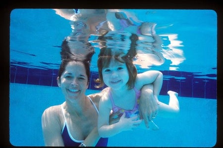mom and daughter swimming