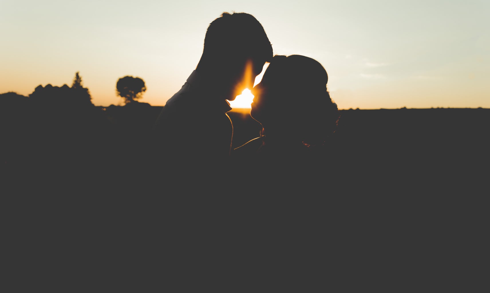 couple in front of sunset