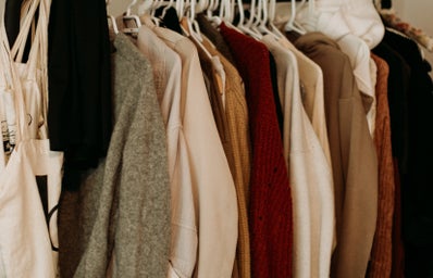 closet with fall tone clothes