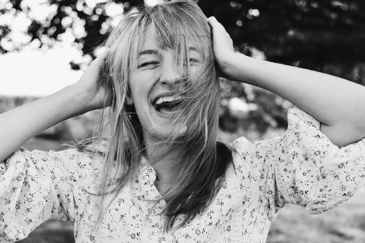 woman with bangs smiling