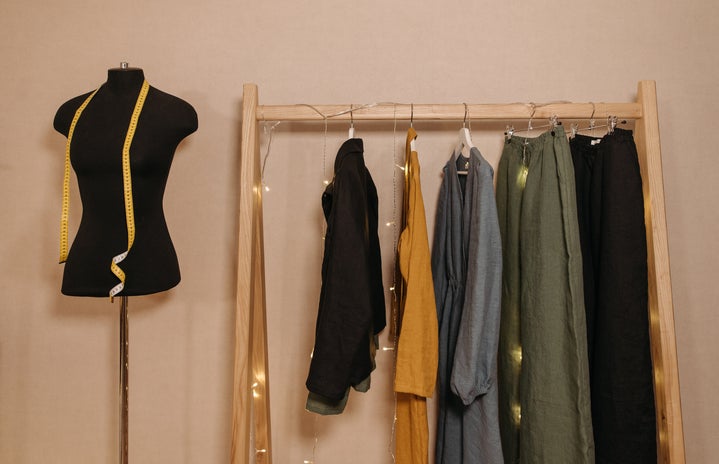 hanging clothes on wooden rack
