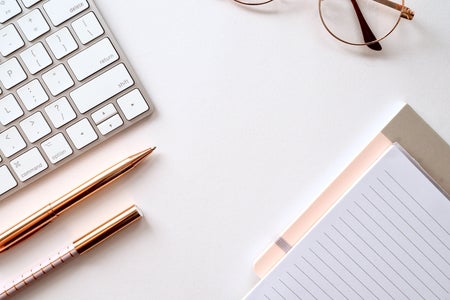 pen and paper on desk