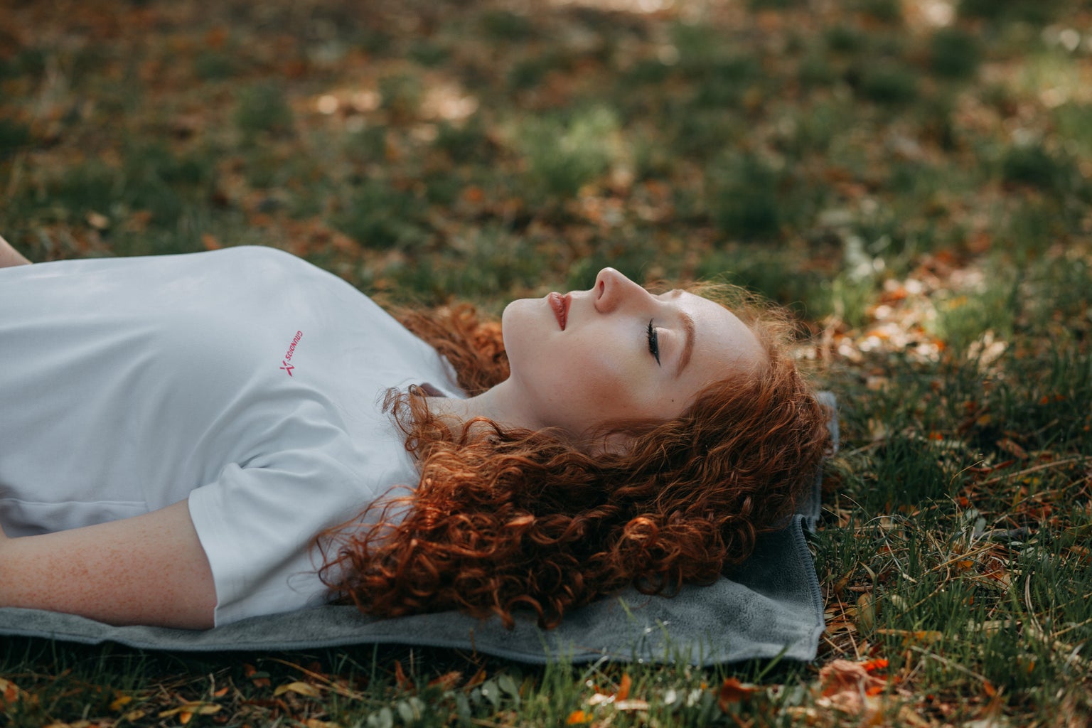 Woman laying down in grass