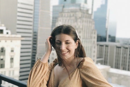 Woman on city rooftop