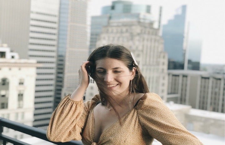 Woman on city rooftop