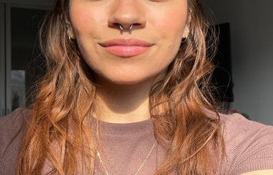 A picture of my nose, lips, shoulders, and new septum piercing