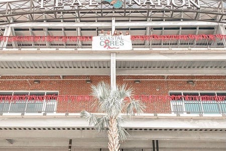 Zeta zeta chapter of the NPC organization Gamma Phi Beta , with their breast cancer awareness display outside of Brooks Stadium at Coastal Carolina University