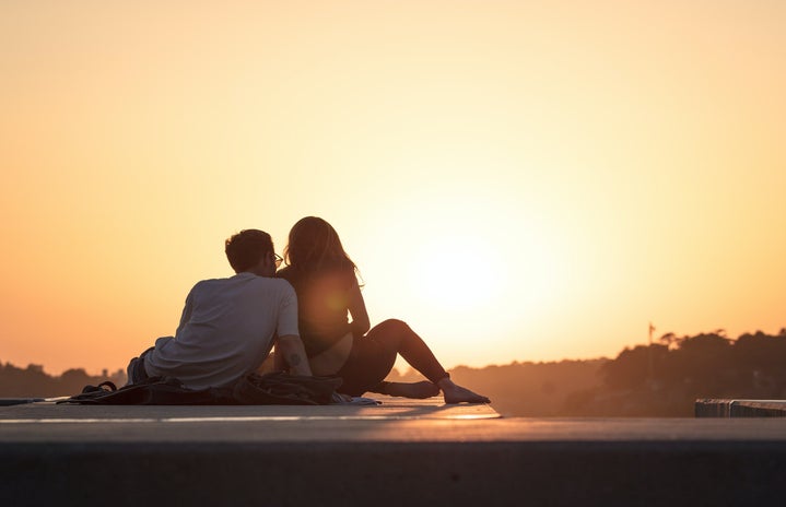 couple watching sunset by Khamko Vilaysing?width=719&height=464&fit=crop&auto=webp
