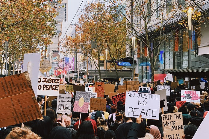 protest signs by Lennon Cheng via Unsplash?width=698&height=466&fit=crop&auto=webp