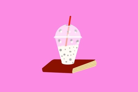 An illustration of a milkshake on top of a book.