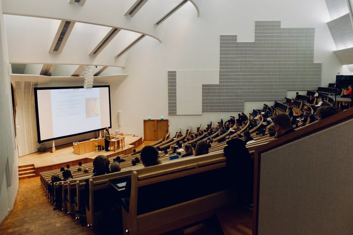 Students in class in a college lecture hall at Aalto University in Espoo, Finland.