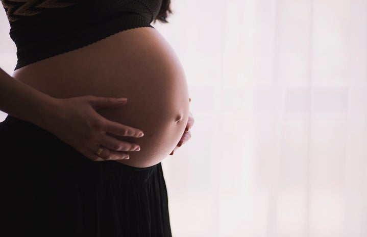 pregnant woman by freestocks from Unsplash?width=719&height=464&fit=crop&auto=webp